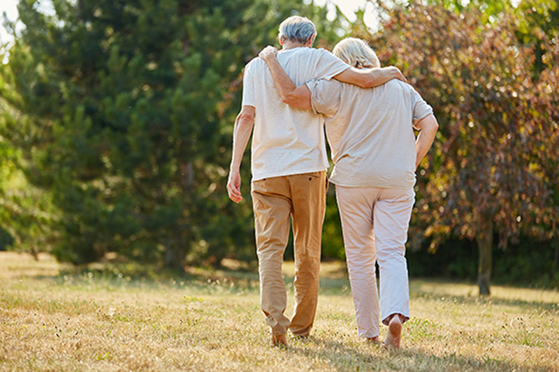 senior couple walking away