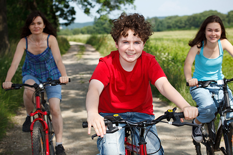 family of three biking